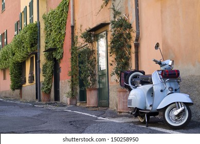 GENOA, ITALY - MAY 14: Old scooter parked in a typical Ligurian narrow street in Boccadasse is an old mariners' neighbourhood of the city of Genoa on May 14, 2012, Italy. 