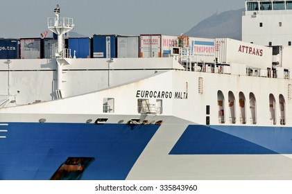 GENOA, ITALY - NOVEMBER 2, 2015: Eurocargo Malta Is A RoRo Ferry Cargo Company Inarme The Grimaldi Group, Built In Hyundai Mipo Shipyard In Ulsan, South Korea. The Ship Enters The Port.  