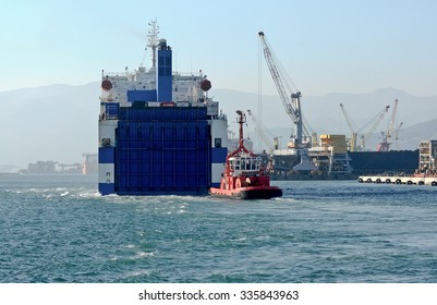 GENOA, ITALY - NOVEMBER 2, 2015: Eurocargo Malta Is A RoRo Ferry Cargo Company Inarme The Grimaldi Group, Built In Hyundai Mipo Shipyard In Ulsan, South Korea. The Ship Enters The Port.  