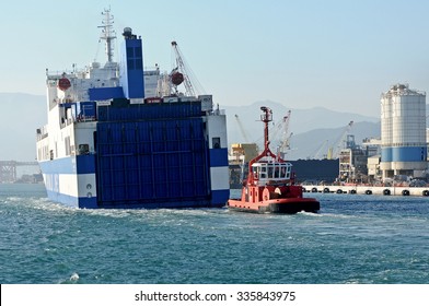 GENOA, ITALY - NOVEMBER 2, 2015: Eurocargo Malta Is A RoRo Ferry Cargo Company Inarme The Grimaldi Group, Built In Hyundai Mipo Shipyard In Ulsan, South Korea. The Ship Enters The Port.  