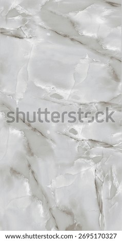 Gentle grey marble surface with subtle white veins and polished finish creates an elegant decorative texture for wall panels.