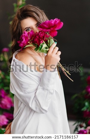 Similar – Woman arranges luxury bouquet of flowers