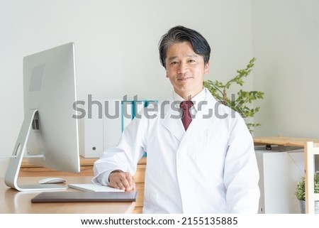 Gentle male doctor in his 50s