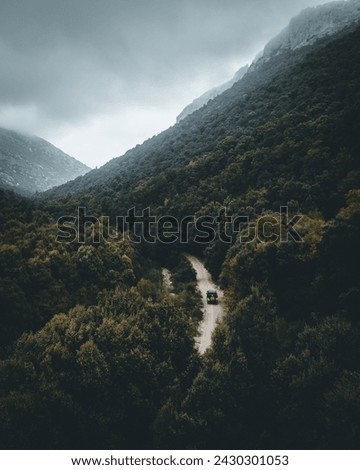 The gentle mist settles over the Sardinian mountains, creating a mystical atmosphere as we navigate the untamed paths with our trusty 4x4. Each turn reveals a new layer of the island