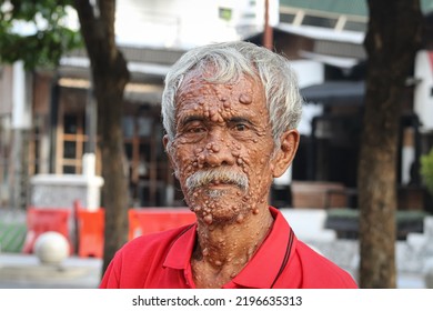 Gentle Old Man In Red Shirt