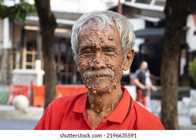 Gentle Old Man In Red Shirt