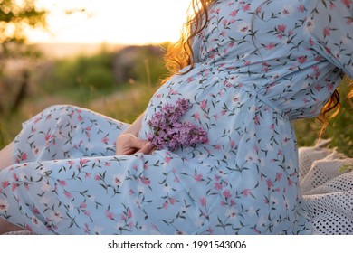 Gentle Pregnancy Photo Session In Lilac In May, A Girl In A Blue Dress