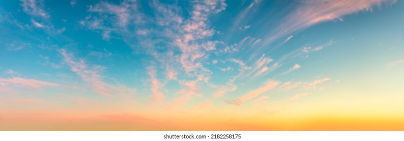 Gentle Romantic Pink Cirrus Clouds In The Dawn Sky. Delicate Mood Of The Sunrise Sundown Sunset Sky. Panorama. There Are No Birds In The Sky