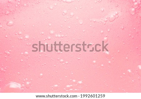 Gentle soft pink slime with gold glitter and shimmer with bubbles texture. Youth trendy abstract background.