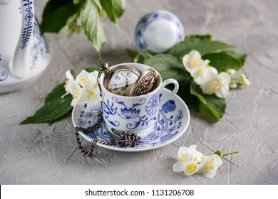 A gentle still-life with a tea set and jasmine flowers.