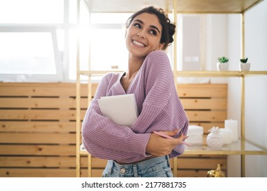 Gentle sweet girl in purple sweater posing at camera smiling sincerely from. Radiant brunette woman with beautiful appearance holds diary in hands. Positive female student with notebook organizer  - Shutterstock ID 2177881735