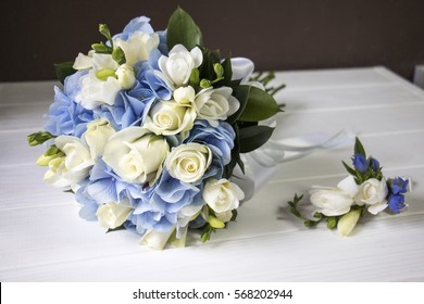 blue hydrangea and white rose boutonniere