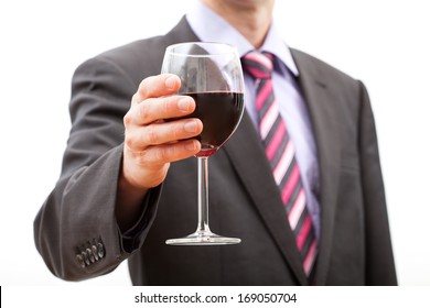 Gentleman making a toast with a glass of red wine. - Powered by Shutterstock