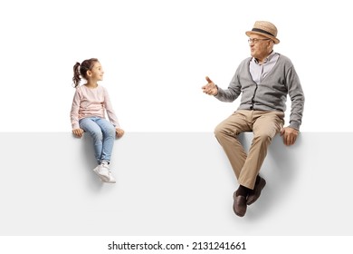 Gentleman Sitting On A Blank Panel And Talking To A Child Isolated On White Background