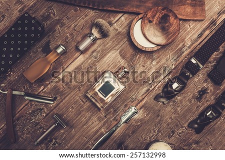 Gentleman's accessories on a on a luxury wooden board 