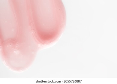 Gently Pink Smear Shower Gel With Bubbles On White Background Banner Format With Copy Space. Lip Balm Swatch. Beauty Cosmetic Product Texture