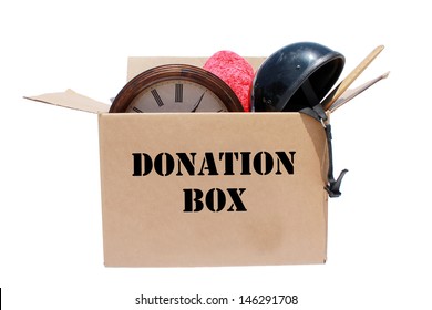 A Genuine Box of used items ready for a garage sale, Yard Sale, Auction, or donation to a charitable organization. One man's junk is another man's treasure! Isolated on white with room for your text 