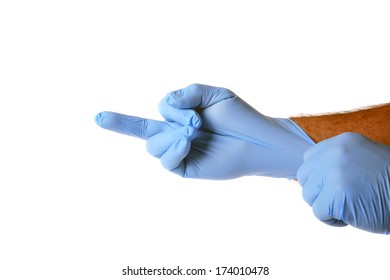 A Genuine Doctor, Surgeon, Nurse, Scientist Or Researcher Puts On Latex Protective Gloves Before Surgery Or An Exam. Exam Gloves Protect People From Disease.   Isolated On White With Room For Text.