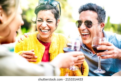 Genuine Friends Drinking Red Wine At Home Pic Nic Party - Mixed Age Range People Having Fun Together At Restaurant Winery Bar On Happy Hour - Dining Life Style Concept With Bright Vivid Filter