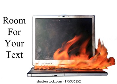 A Genuine Laptop Computer On Fire. Isolated On White With Room For Your Text. Represents Computer Damage, Insurance Claims, Fire Danger, Work Protest, Burning Up The Internet, Hot Chat And E Mails Etc