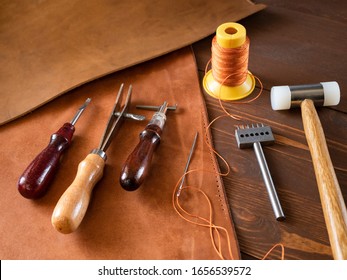 Genuine Leather. Sewing A Purse. Leather Work. Tools For Sewing Bags, Wallets, Clutches. Stitching. Manual Sewing Of The Product. The Manufacture Of Leather Products. 