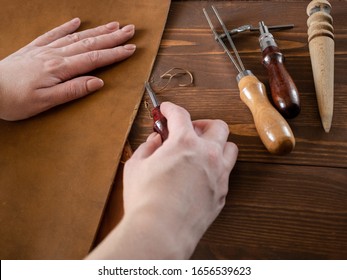 Genuine Leather. Sewing A Purse. Leather Work. Tools For Sewing Bags, Wallets, Clutches. Stitching. Manual Sewing Of The Product. The Manufacture Of Leather Products. 