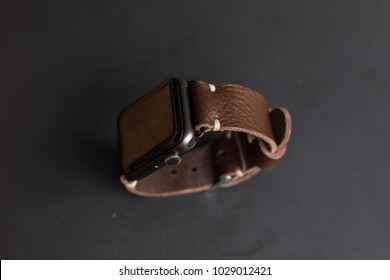Genuine leather watch  strap with smart watch on black background