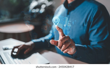 geo, location, mark, diagram, future, intelligence, management, innovation, strategy, information. A man is pointing at a map on a computer screen. The map is a digital representation of the world.