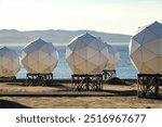 geodesic domes, satellite communication, Arctic, Greenland, technology, coastal landscape, scientific research, satellite station, remote location, modern infrastructure, antennas