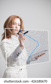 Geographic Information Systems Concept, Woman Scientist Working With Futuristic GIS Interface On A Transparent Screen.