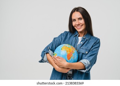 Geography concept. Caucasian young woman eco-activist hugging embracing Earth globe with care, protecting planet from contamination, garbage, traveling abroad isolated in white background - Shutterstock ID 2138383369