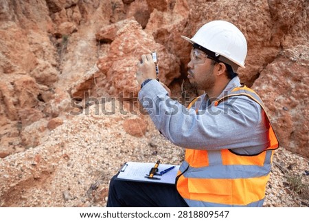 Geological Engineer Performing Site Documentation at Sedimentary Rock Outcrop Location