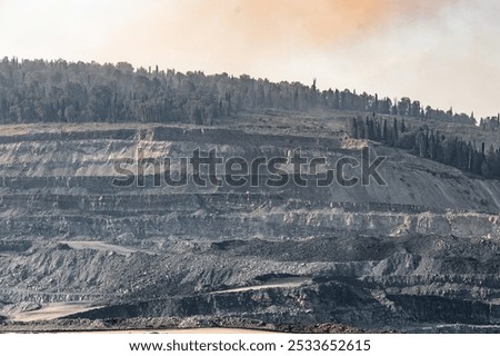 Geological section of soil, layers of coal and rock. Overburden open mine anthracite. Dark texture black color.