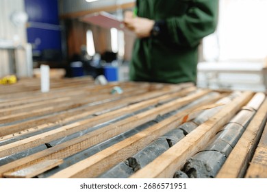 Geologist evaluating core samples in geological laboratory. Mining geology exploration of minerals.