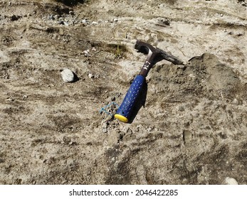 Geology Hammer In Top Sediment Rock