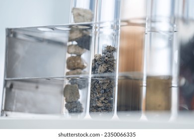 Geology science laboratory research concept, sample test analysis of nature dirtied ground in environment and ecology experiment, agriculture agronomy material to working with scientific equipment - Powered by Shutterstock