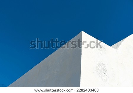 geometric abstract sample of traditional greek whitewashed building architecture, blue and white colors, wall, sky, corner