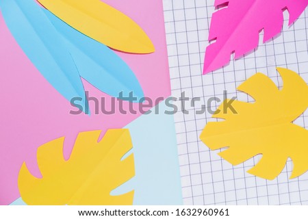 Geometric background pattern texture of colorful palm leaves. Summer beach concept. Flat lay. Memphis style.