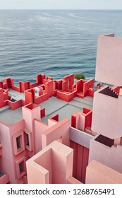 Geometric building construction. The red wall, La manzanera. Calpe, Spain
