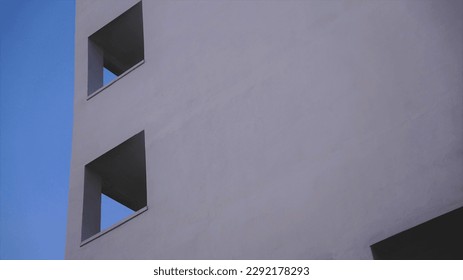 geometric building facade frames against the sky