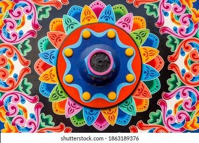 Geometric and colorful decorations of the wheels of traditional coffee transport carts in Costa Rica, Sarchi