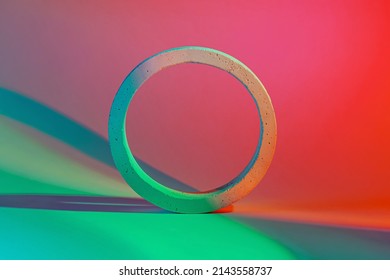 Geometric concrete figure on bright neon background. Stylish geometric shapes.  - Shutterstock ID 2143558737