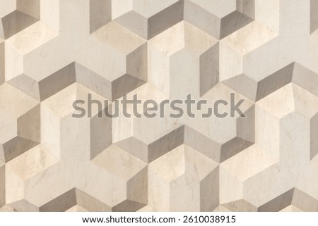Geometric concrete wall pattern with a three-dimensional cubic design in neutral tones creating an artistic and stylish visual effect for design projects or architectural inspiration