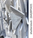 Geometric cuts of marble tiles and textured scultpure