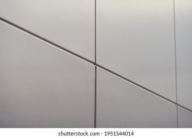 Geometric elements of the building facade with planes, lines, corners with highlights and reflections. Abstract background. Place for text