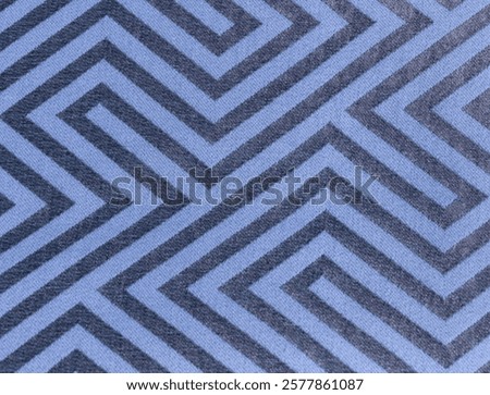 Geometric fabric pattern as background. closeup of a color carpet or rug. Ajiro geometric backdrop. Tribal style with traditional folk design.zigzag lines.Modern Japanese style textile backdrop