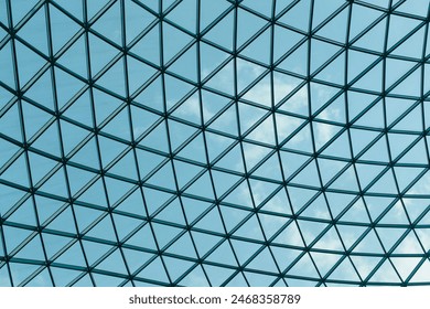 Geometric glass ceiling with blue sky - Powered by Shutterstock