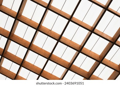 Geometric interior. Roof background. Glass ceiling texture. Wooden construction. Wood architecture. Bright white light. - Powered by Shutterstock