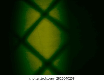 Geometric mesh shadow pattern with moody green lighting and dark vignette