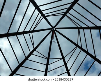 Geometric octagonal construction design with sky and clouds - Powered by Shutterstock